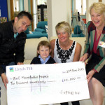Sophie and family with cheque: