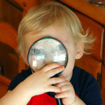Kid with magnifying glass by jcorduroy