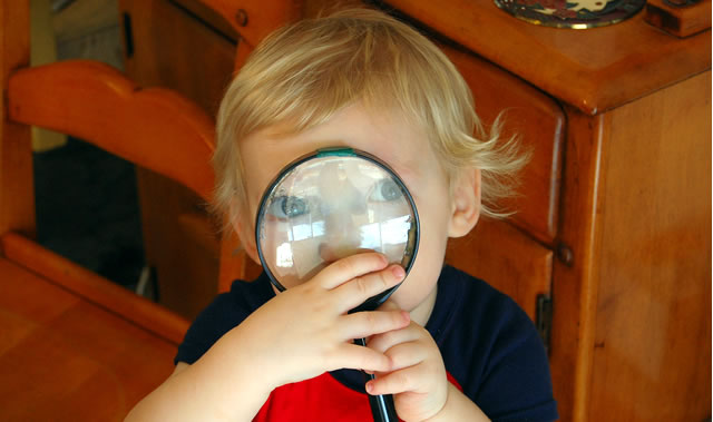Kid with magnifying glass by jcorduroy
