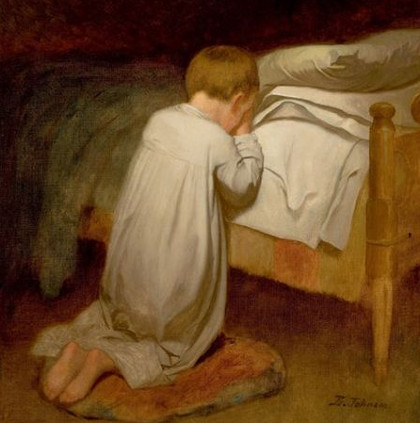 Child praying at bedtime 