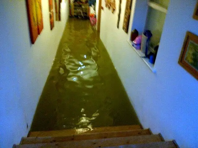 Flooding inside house in the Strand - by Wayne Whittle