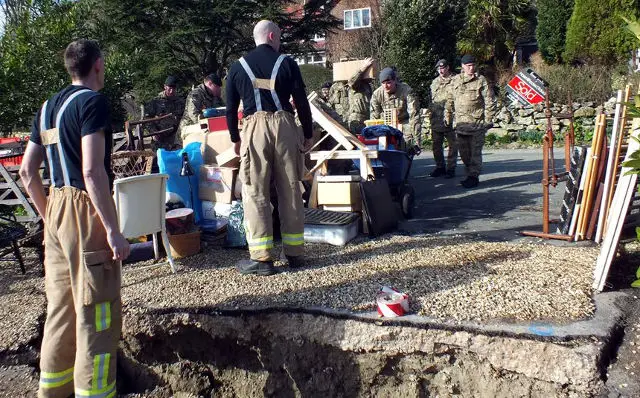Items outside a house (crop) - Army and firemen - Undercliff landslip Feb 2014 by IWC
