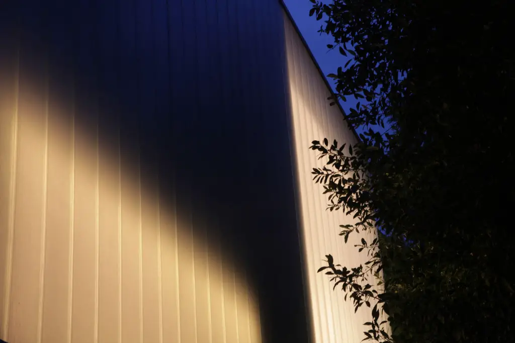 Malabar colour exterior - at night glass panels - D Brookes and A Goodwin