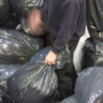 Man with rubbish bags by dogbomb