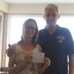 Kay Ounsworth handing in cheque to RIR: