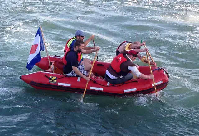 Wightlink staff paddle across the Solent