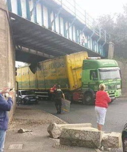 Lorry stuck under bridge