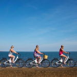 Blackman powerbikes women on the coastline