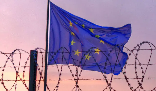 EU flag behind barbed wire by windytan