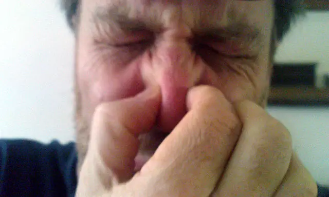 Man holding nose - bad smell - by brian-fitzgerald