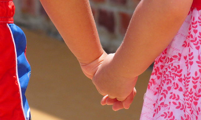Children holding hands: