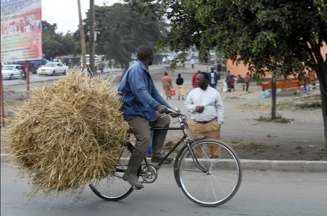 African riding a bicycle