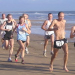 People running on the beach