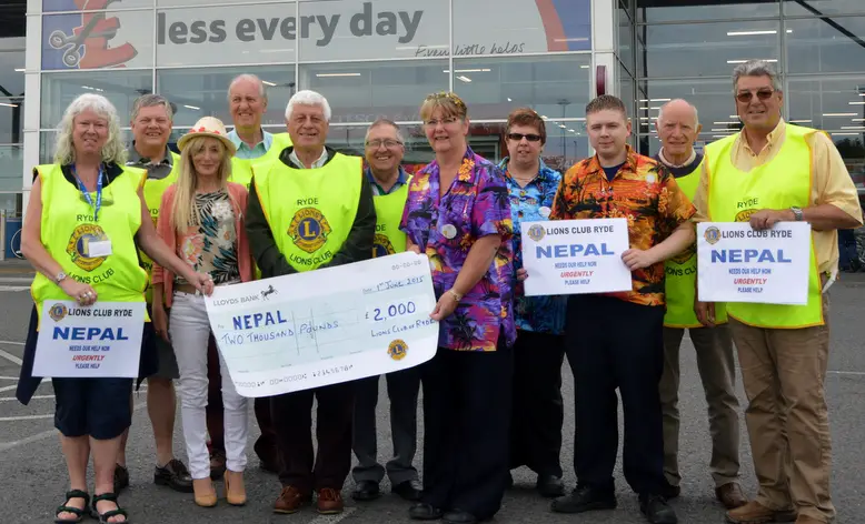 Cheque for Nepalese victims at Tesco