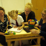 Eight year old Bailey-Ann makes good use of some items bought by the Friends, watched by (left to right) paediatric occupational therapist Amy Duncan, Bailey-Ann’s mother, Lisa Manser, and teaching assistant, Julie Wallace