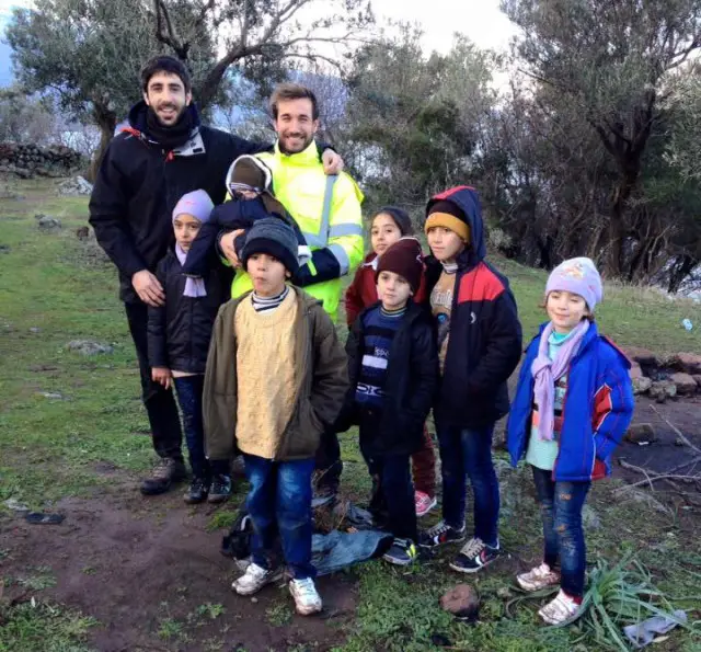 Two of the volunteers with some of the children in Lesvos