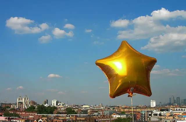 Gold star balloon over London