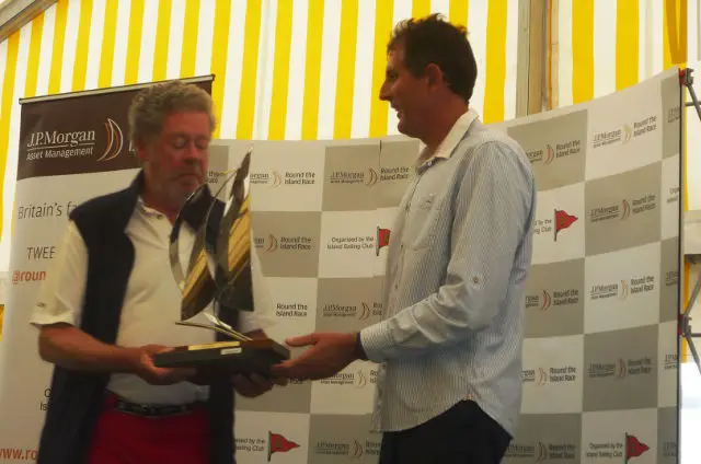Owner/skipper of La Réponse (Team GBR Red) Andrew McIrvine receiving a trophy from Brian Thompson after the JPMAM RTI Race