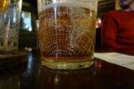 pint glass with world map