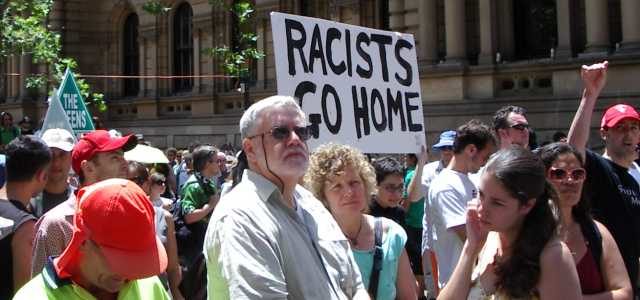 racists go home banner