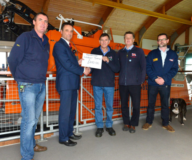 Bembridge, RNLI Left, Ken Ratcliffe (RNLI Crew), Philip Weeks (HRD), Steve Simmonds (RNLI), Mike Samuelson (RNLI), Justin Gentlemen (RNLI) and Jackson (Dog) Philip Weeks Presenting £250 to Steve Simmonds for The RNLI