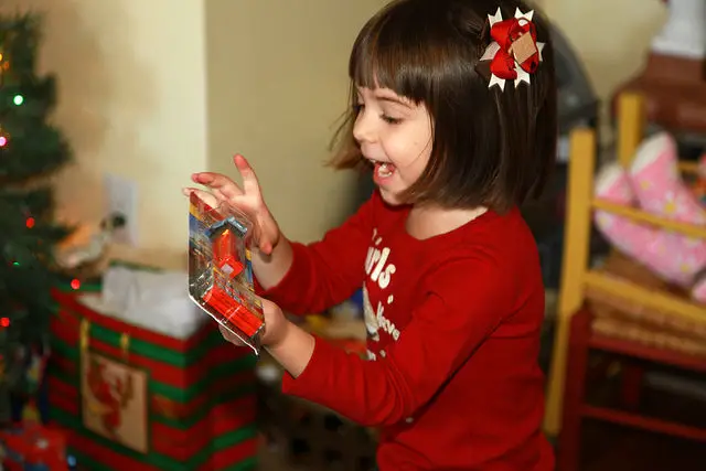 Little girl opening a present