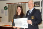 Ryde Rowing Club Captain Pete Allsopp presenting the cheque to Felicity Radak of the IW Youth Trust