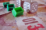 monopoly-houses-ten-pound-notes-and-dice