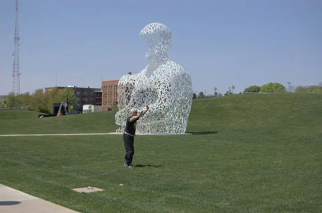 someone doing tai chi in a sculpture park