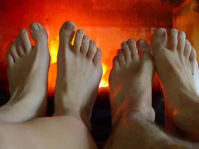feet in front of the fire 