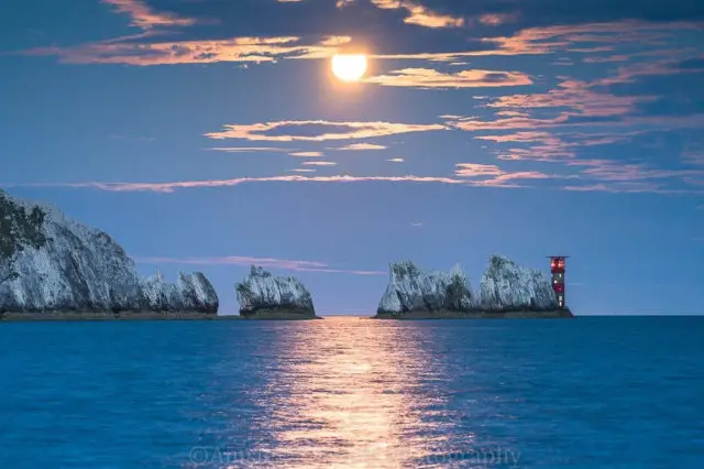 Moon setting behind the Needles by Ainsley Bennett