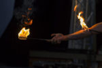 street artist plays with flames and fire during show