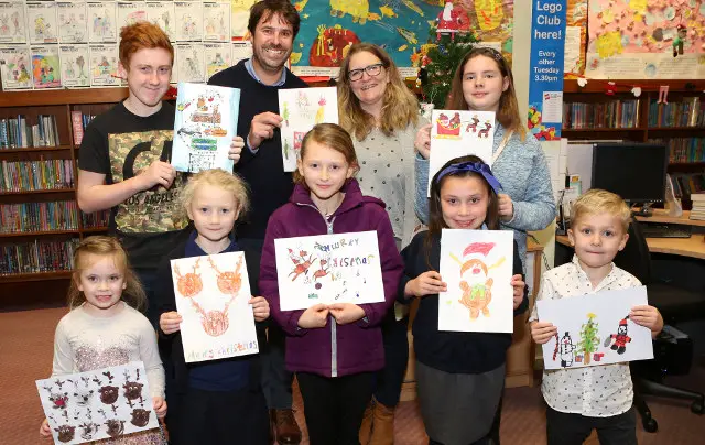 Ryde Business Association Christmas Card Competition 30 11 2017 Ryde Library Left to right Back Row,Dylan Lewis 13, Zoe Thompson [RBA Chair] Judge Tony Beardsall [they both hold card by Sophie Harris 6 who couldn't make the photo], Kira Lacey 13 Front Row L to R Amelia Boswell 4 Isabella Stanbridge 6 Abby Flannagan 6 Maisie Sullivan 9 Stanley Kerr 6 Copyright Graham Reading Photography credit grahamreading.com