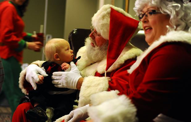 baby with mr and mrs santa claus 