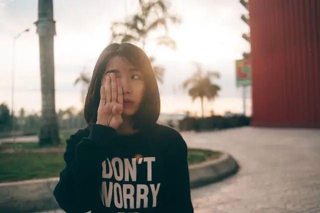 Woman with don't worry sweater 