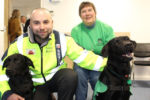 Image: Island Roads' Ben Meakin with Ability Dogs 4 Young People founder Carol Court and ability dogs Lucy and Sam