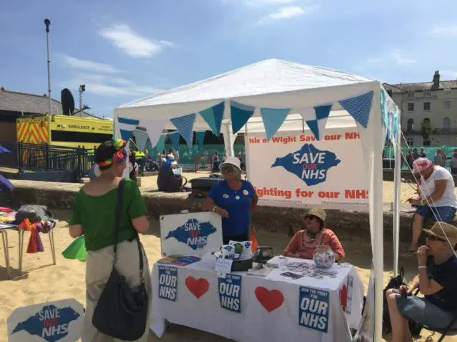 Caroline Lucas at the Save NHS IOW stall