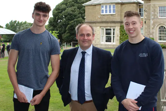 gcse RESULTS RYDE SCHOOL Ollie Russell and Jevon Dry with the Head Master Mark Waldron