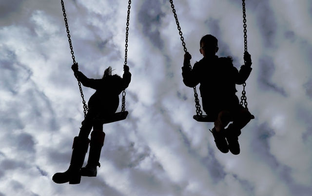 children on swings