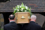coffin being carried into church
