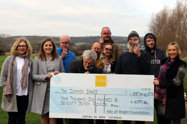 Island Roads Foundation present cheque to The Common Space and team in Sandown Bay photo