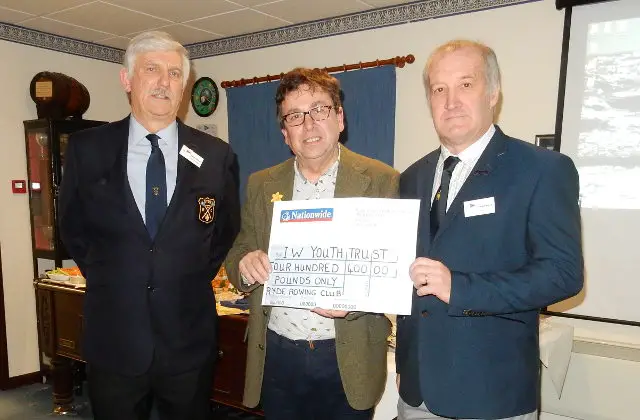 Ryde Rowing Club President Pete Allsopp and Captain Graham Reeve presenting the cheque to Michael Lilly of the IW Youth Trust