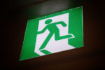 Green running exit sign