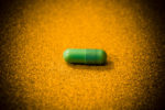 green antibiotic capsule
