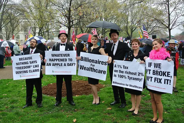 People dressed up for the billionaires for wealthcare march