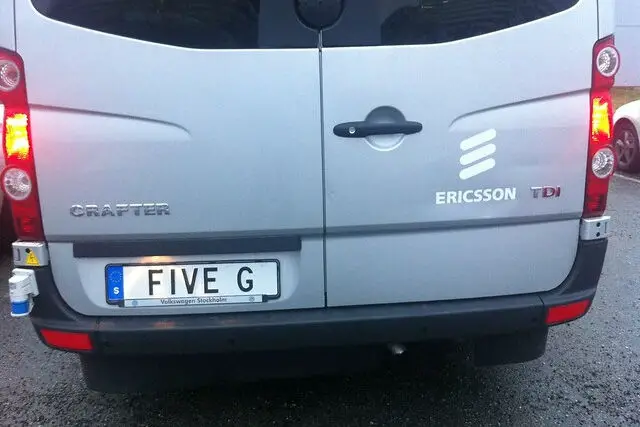 van with giveG as registration plate