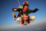 Two people sky diving