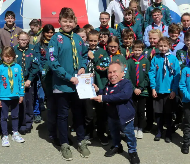 Dylan receiving his Chief Scouts Gold Award from Warwick