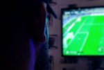 man watching sport on tv by obayda PH