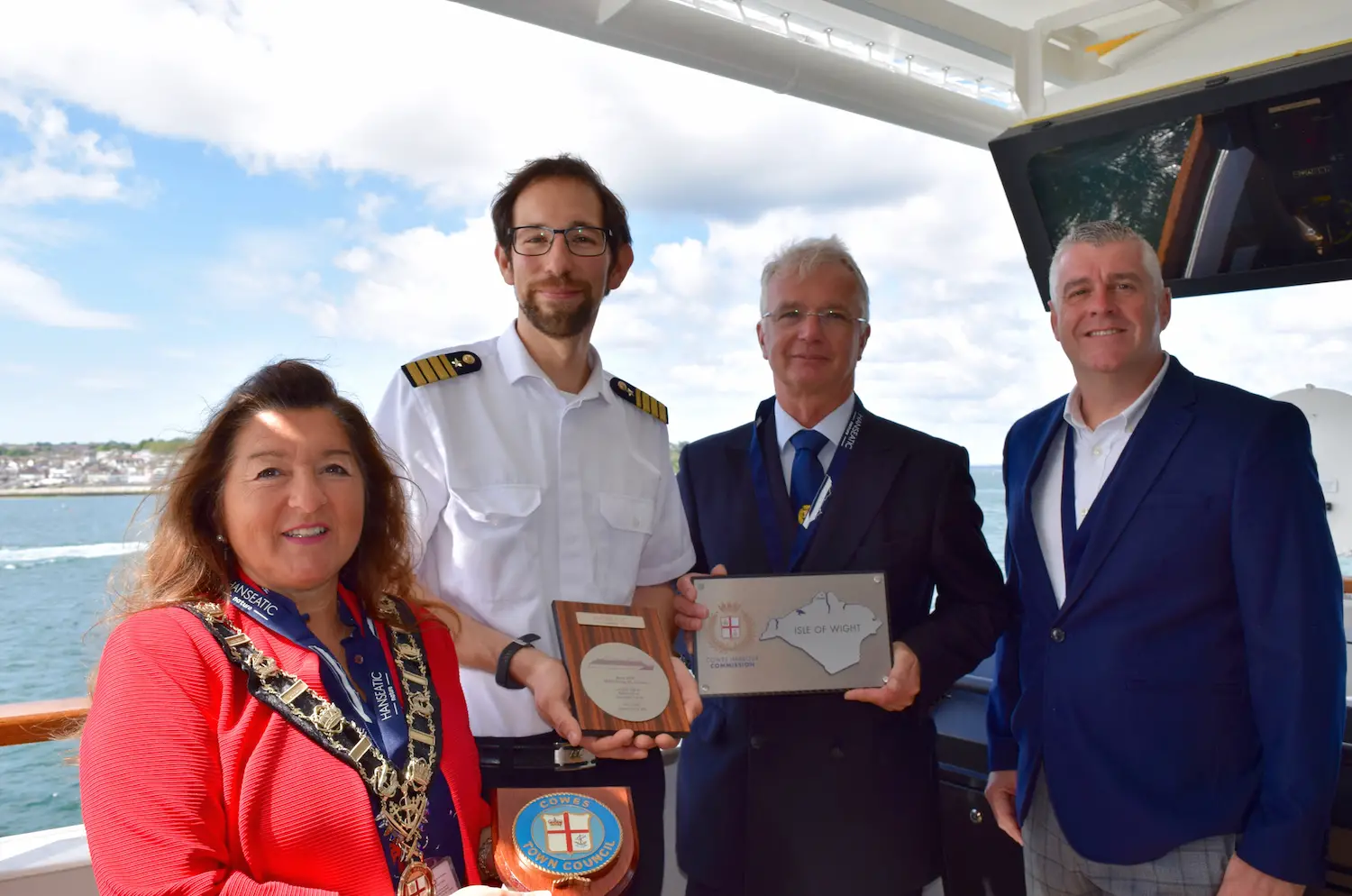 Cowes Mayor Lora Peacey Wilcox, Staff Captain Christoph Kunz of HANSEATIC Nature, Cowes Harbour Master Capt. Stuart McIntosh, Visit Isle of Wight Chairman Ian Griffiths.